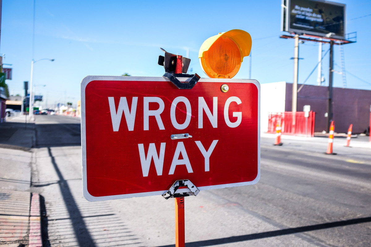 Red coloured Wrong Way signage on the road - Top Mistakes to Avoid During a Visa Interview