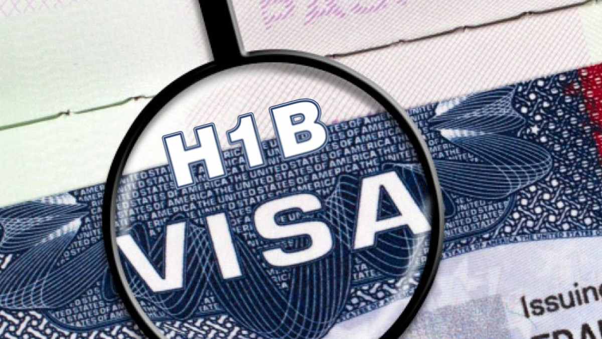 H-1B visa written under a magnifying glass - US Lawmaker Advocates for Increased H-1B Visas